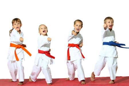 Four children in kimono hit a punch の写真素材