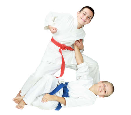 A boy throws a baby boy on white background isolated