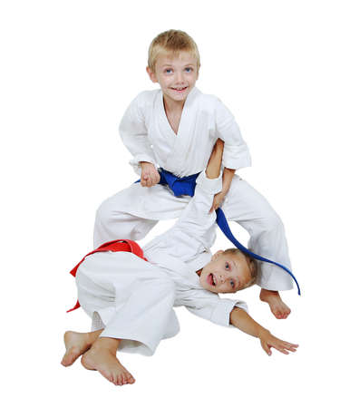 Sister in kimono throws the brother in a kimono isolated の写真素材