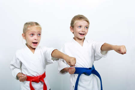 Cheerful brother and sister athletes a punch armの写真素材