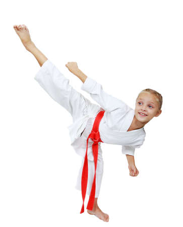 Girl in white kimono beats kicking isolated の写真素材