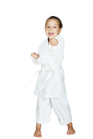 On a white background little girl beat a punch armの写真素材