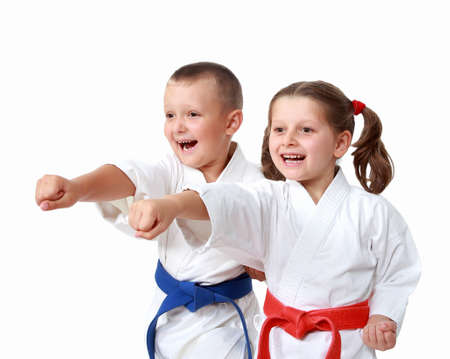 Happy athletes in a kimono beat punch armの写真素材