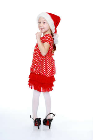 In her mother s shoes and a red polka dot dress little girlの写真素材