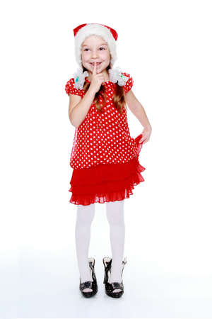 Beautiful little girl in a cap of Santa Clausの写真素材