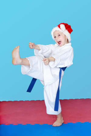 In a white kimono and wearing hat Santa Claus girl  blow kicksの写真素材