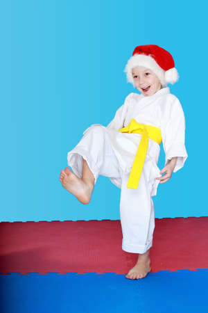 Sportswoman wearing Santa Claus with a yellow beltの写真素材