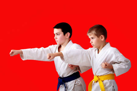 Blows arms in perform athletes  with blue and yellow beltの写真素材
