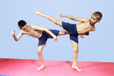 Blows legs are training two athletes in shortsの写真素材