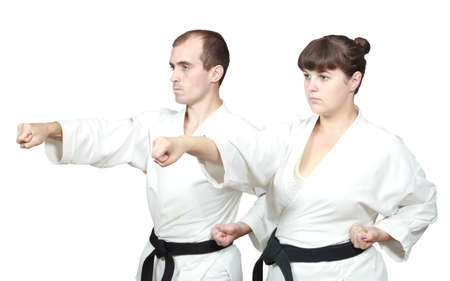 On white background two adults sportsmen are beating punch handの写真素材