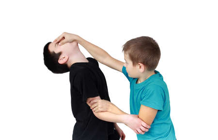 Boy in blue T-shirt holds reception against the boy in a black T-shirtの写真素材
