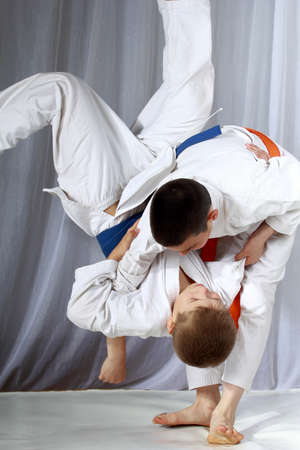Boys in judogi are training throwingの写真素材