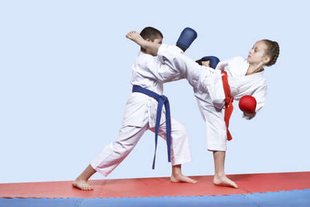 Boy and girl in karategi are training paired exercises karateの写真素材