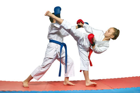 Two athletes with overlays on the hands are training paired exercises of karateの写真素材