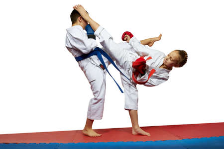 Boy and girl in karategi beats kicksの写真素材