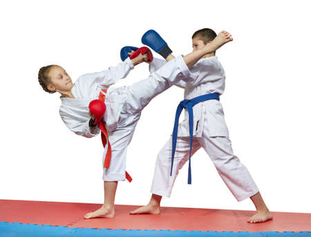 Sportswoman is beating high kick leg to the head an athleteの写真素材