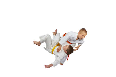 An athlete with orange belt throws athlete  with yellow beltの写真素材