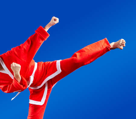 Sportswoman dressed as Santa Claus hits a high kickの写真素材