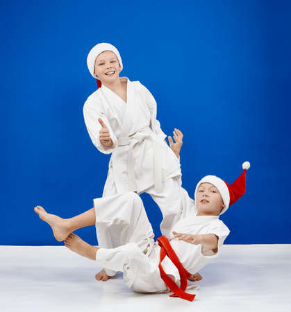 Cheerful athletes trains throws judo
