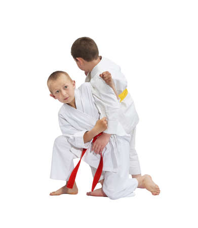 An athlete with a red belt makes a grab for the throwの写真素材