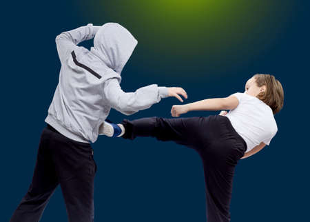 Little girl beats kicking bullyの写真素材