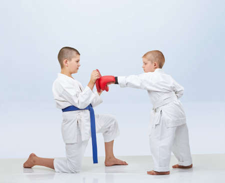 Little karateka beats punch on the simulator that brother keepsの写真素材