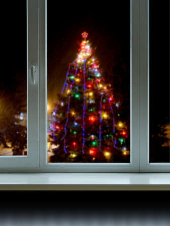 Christmas tree outside the windowの写真素材