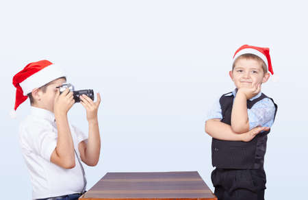 Older brother is photographing younger which posingの写真素材