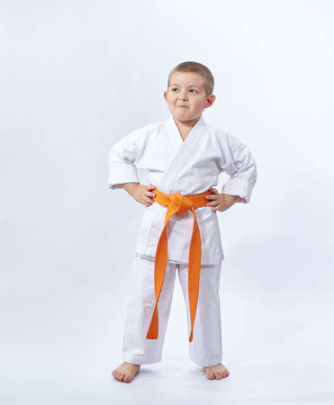 Karateka with orange belt on white backgroundの写真素材