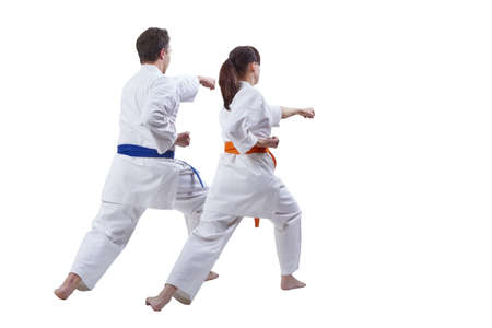 Husband and wife sportsmen beat a punch hand against a white backgroundの写真素材