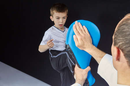 Direct kick small athlete is beating on the simulatorの写真素材