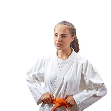 With an orange belt sportswoman on a white backgroundの写真素材