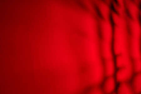 Strips of black on a scarlet backgroundの写真素材