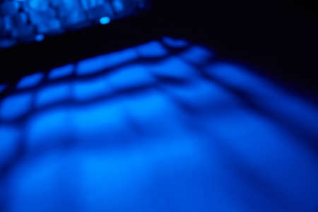 Dark blue background with blurred blue glow