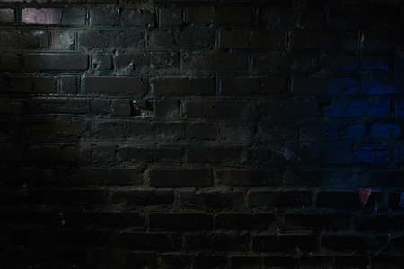 Blue highlight on the wall illuminated with white lightの写真素材