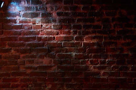 Blue lantern light on a brick wallの写真素材