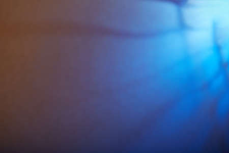 Blue background with yellow huesの写真素材