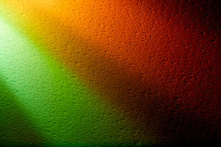 Parallel rays of light against the background of green and yellow
