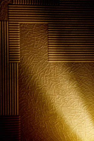 White ray of light on a yellow background with patterns