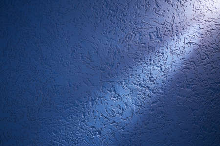 Light blue ray of light dissecting patterned blue background