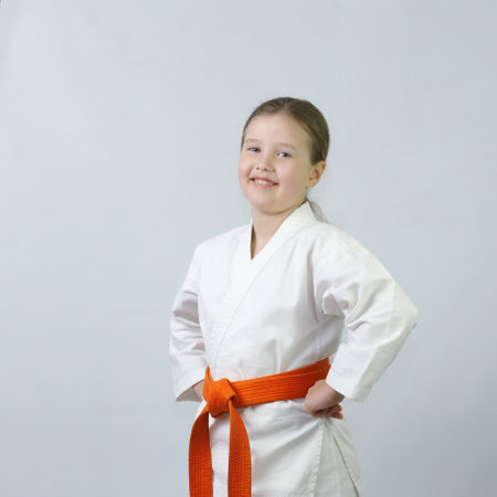 Cheerful sportswoman on a light backgroundの写真素材