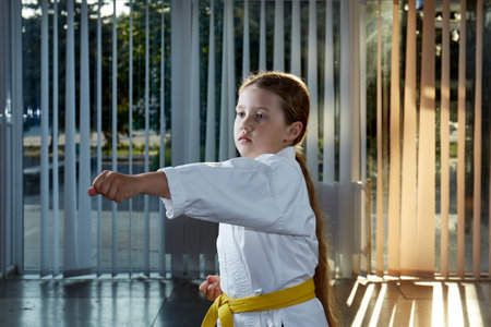 Child athlete is training blow the handの写真素材