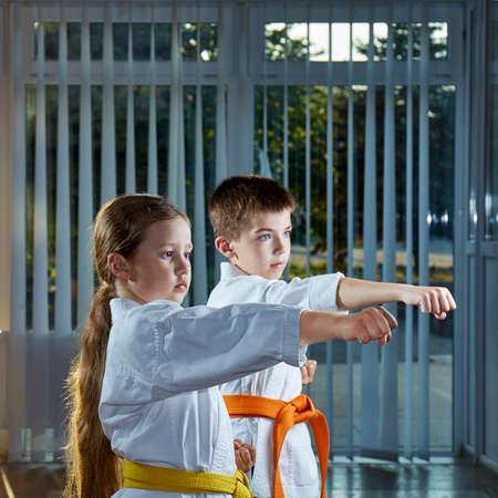Children in karategi are beating blow handの写真素材
