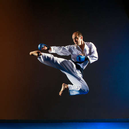In a high jump athlete in karategi beats kick legの写真素材