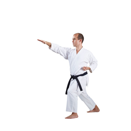 On a white background, formal exercises of karate are trained by an adult athleteの写真素材