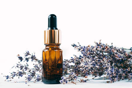 Essential oil of lavender in a bottle on an isolated background.の写真素材