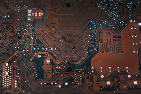 The motherboard is upside down in brown. Top view close up