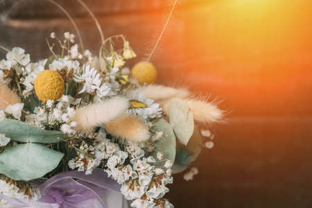 Beautiful bouquet of dried flowers close-up. Decoration, home decor. Delicate flower bouquet. Copy spaceの写真素材