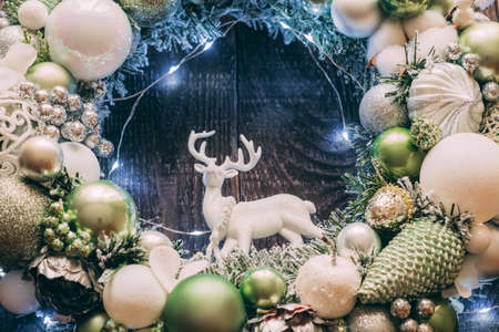 Christmas wreath with deer close-up. Lights on the wreath.