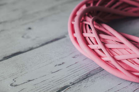 Part of wicker wreath on table close-up. Detail of a handmade basketの写真素材